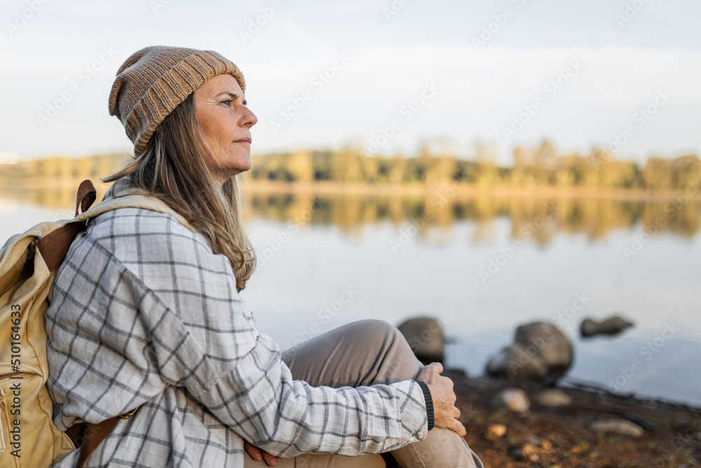 mature woman sitting in the middle of nature mature woman sitting in the middle of nature