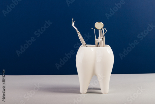  huge tooth with dental equipment photo