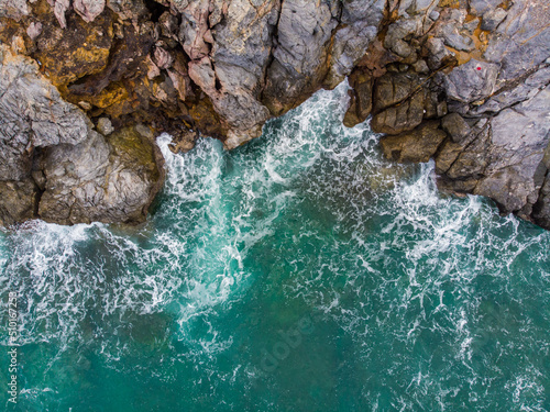 Aerial view sea cliff rocky sea wave on beach