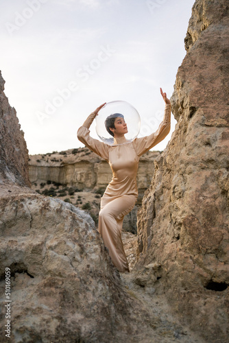 Landscape With A Dancer With Salmon Dress And Transparent Helmet photo