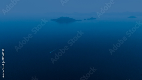drone landscape at night, lonely island in the mist