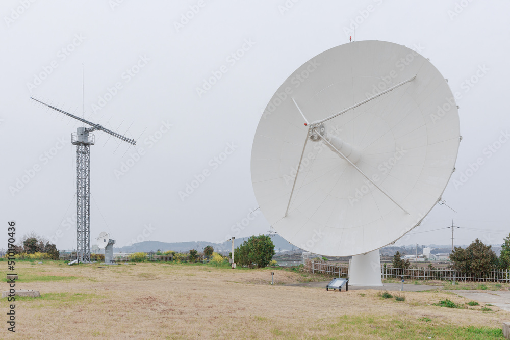 A large antenna in the field. A large antenna in the field.