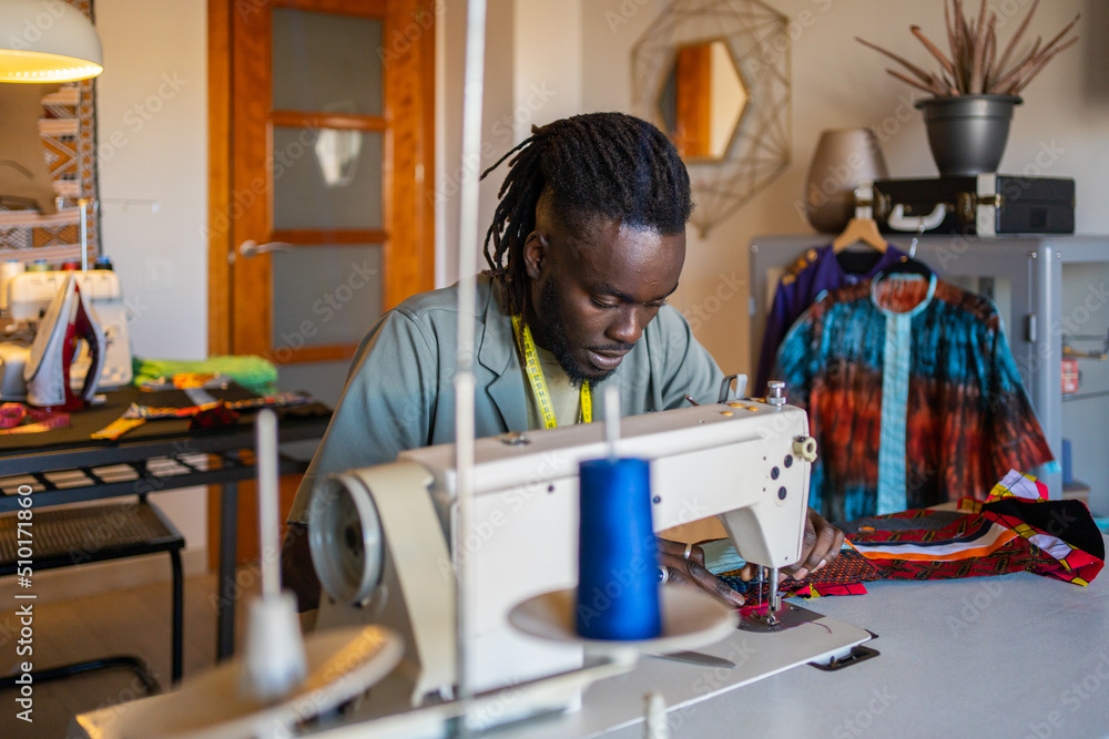 Black Man Entrepreneur, Tailor Working In A Fashion Design Studio. Black Man Entrepreneur, Tailor Working In A Fashion Design Studio.