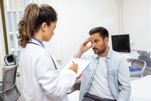 Patient receiving bad news, he is desperate and sad, Doctor support and comforting patient with sympathy. Don't worry, this medical test is not so bad