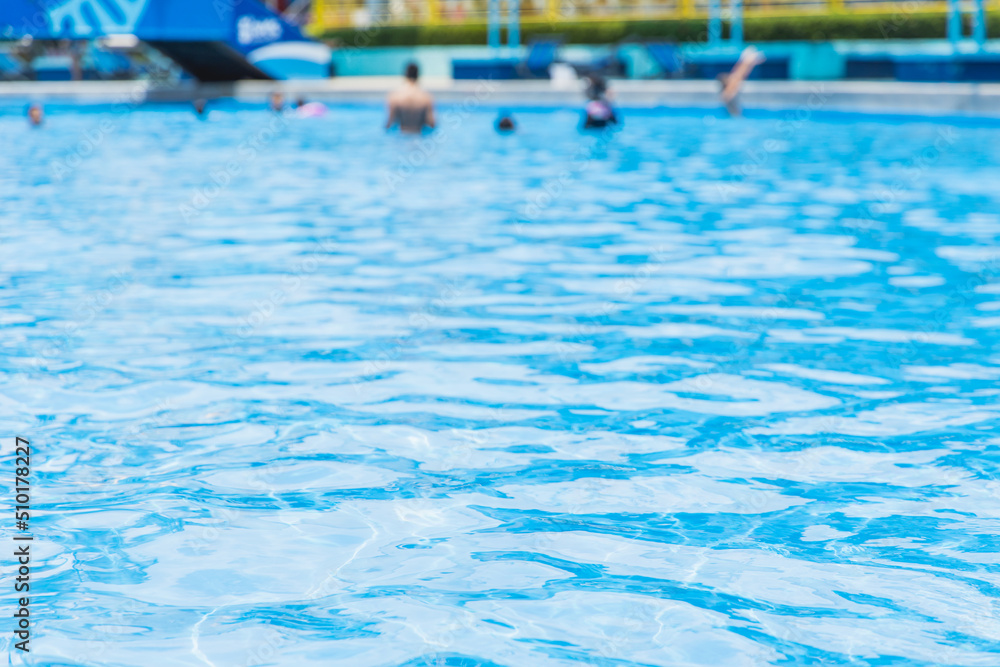 swimming pool blue water people leisure playing in summer season