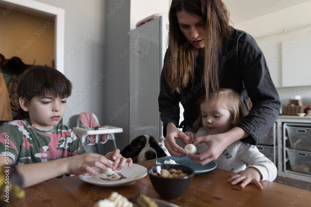Mother peels boiled eggs Mother peels boiled eggs
