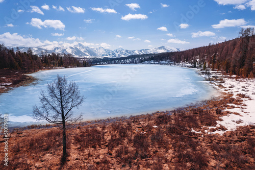 Beautiful autumn landscape Kidelu lake in Altai mountains Russia with sunlight. Aerial top view