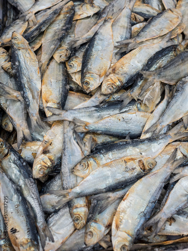 Sun-Dried Herring Fish (Tuyong Salinas) for sale at a market. photo