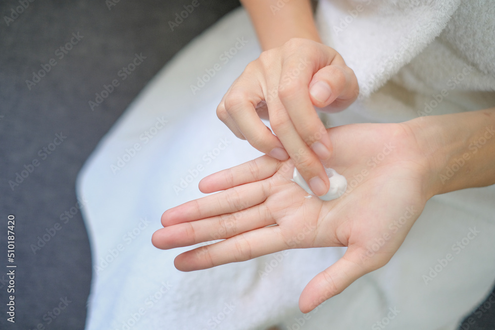 Woman applying natural cream, Woman moisturizing her hand with cosmetic cream, Spa and Manicure concept. Woman applying natural cream, Woman moisturizing her hand with cosmetic cream, Spa and Manicure concept.