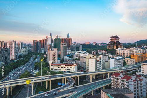 The urban skyline of Nanning, Guangxi, green bamboo interchange and Yongzhou Pavilion in the evening photo