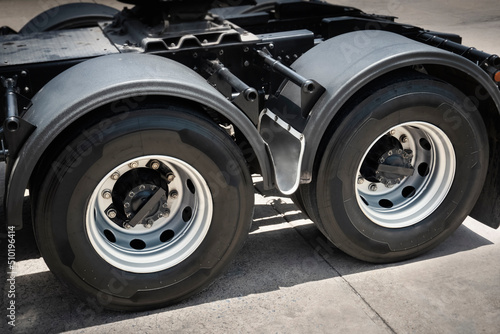 Rear of Semi Truck Wheels Tires. Rubber, Vechicle Tyres. Freight Trucks Cargo Transport. Auto Repair Service Shop. 