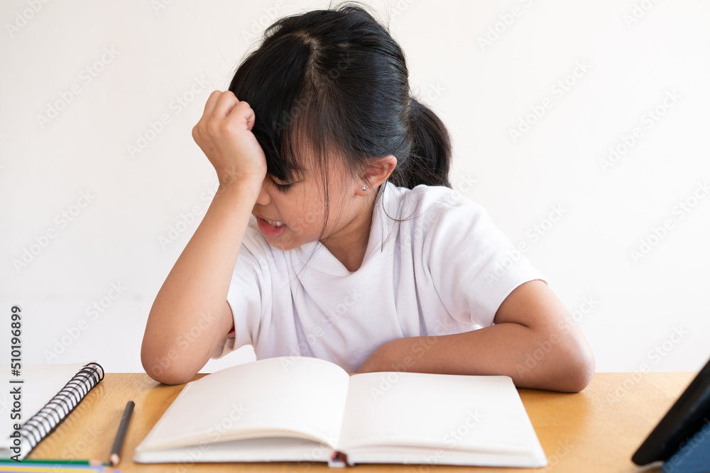 girl serious with learning online during coronavirus . girl serious with learning online during coronavirus .