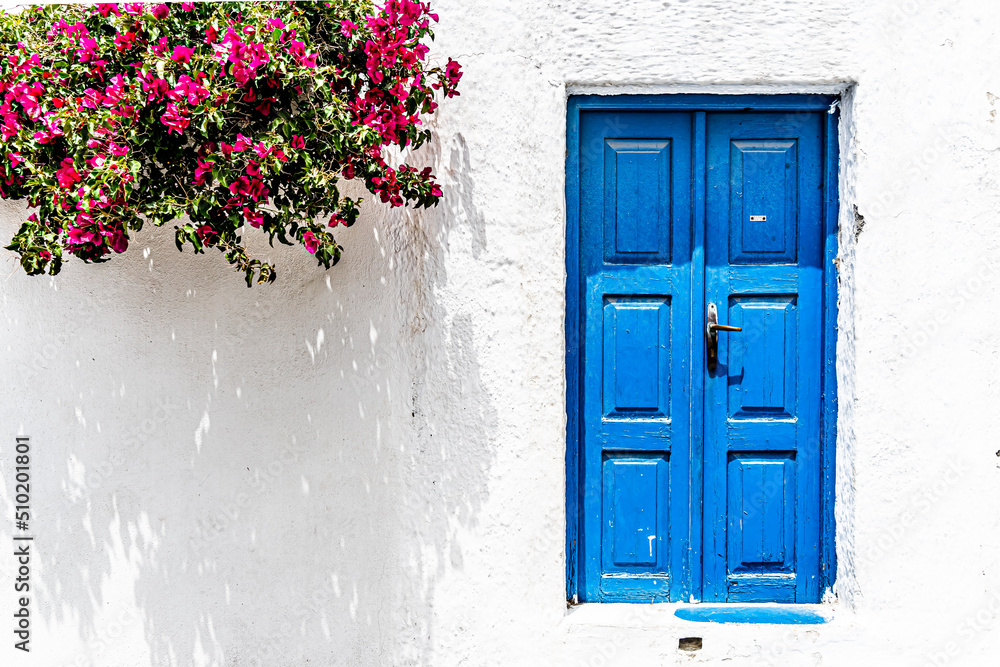 Traditional greek style door in a town house on Santorini island Traditional greek style door in a town house on Santorini island