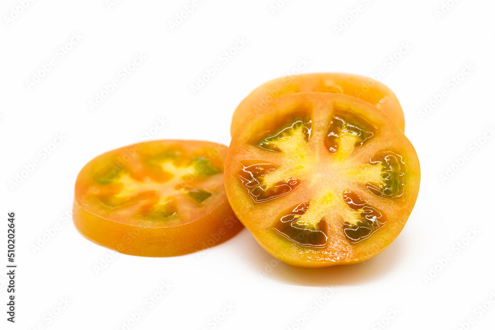 Fresh tomatoes slices isolated on white background.
