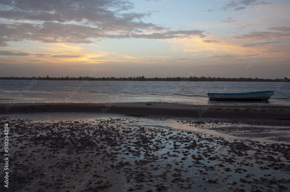 Boat at sunset in the Senegal River. Langue de Barbarie National Park. Saint-Louis. Senegal.