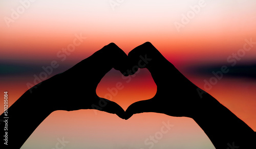 Silhouette of hands, heartfelt expression, hand-painted expression of love, valentine's day concept.