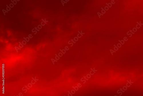 Red cloud texture background. Blurred photo of red sky with clouds. Photo can be used for galaxy space, New Year, Christmas and all celebrations backgrounds.	

