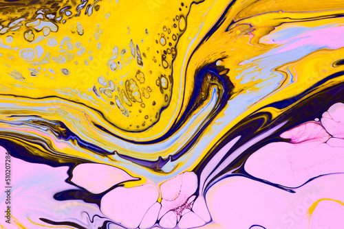 Fluid art texture. Backdrop with abstract swirling paint effect. Liquid acrylic artwork that flows and splashes. Mixed paints for background or poster. Yellow, blue and pink overflowing colors.