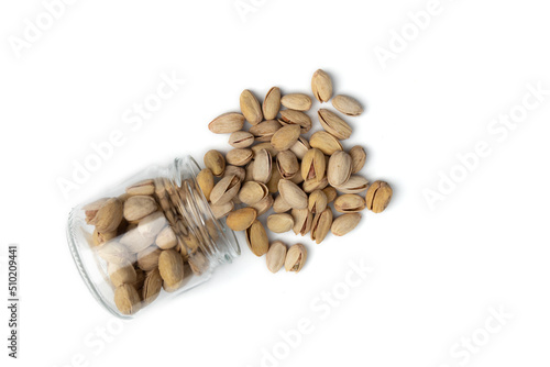 heap of unpeeled pistachio isolated on white background