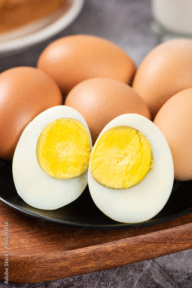 slice of peeled boiled eggs on table slice of peeled boiled eggs on table