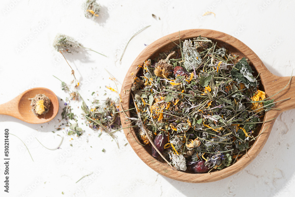 Fototapeta premium herbal tea, dried medicinal herbs on a white background, herbal medicine