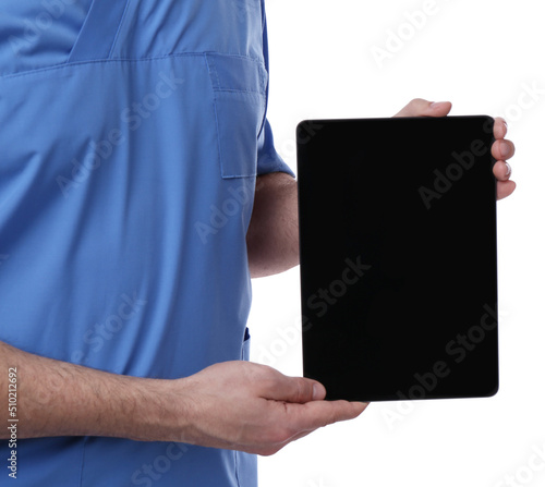 Doctor holding blank tablet on white background, closeup. Space for design