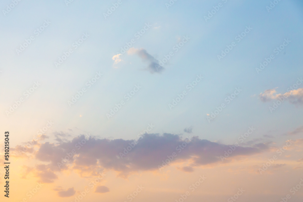 Beautiful cumulus clouds on sunny day at golden hour painted with sun. Atmosphere background Beautiful cumulus clouds on sunny day at golden hour painted with sun. Atmosphere background