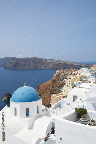 The focus view of the blue-domed church in Santorini.