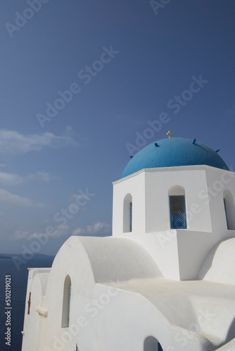 The focus view of the blue-domed church in Santorini.