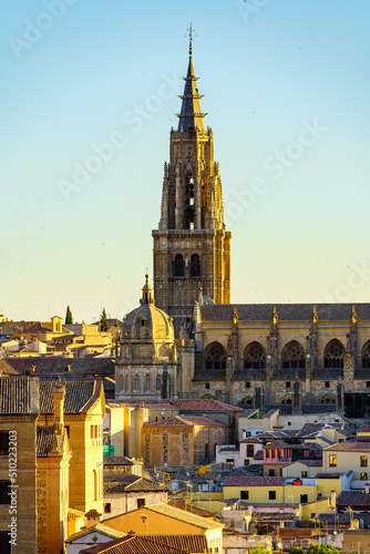Tower of the cathedral of Toledo rising above the buildings of the city.