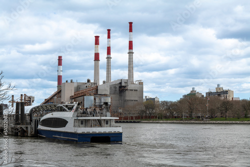 View of Ravenswood Power Station from the East River on a cloudy day. High-quality photo