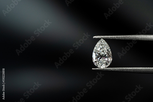 Pear shape diamond with tweezers
