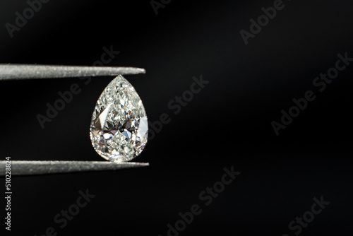 Pear shape diamond with tweezers