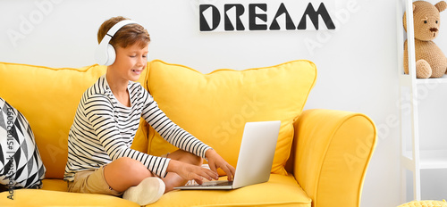 Little boy with laptop list...
