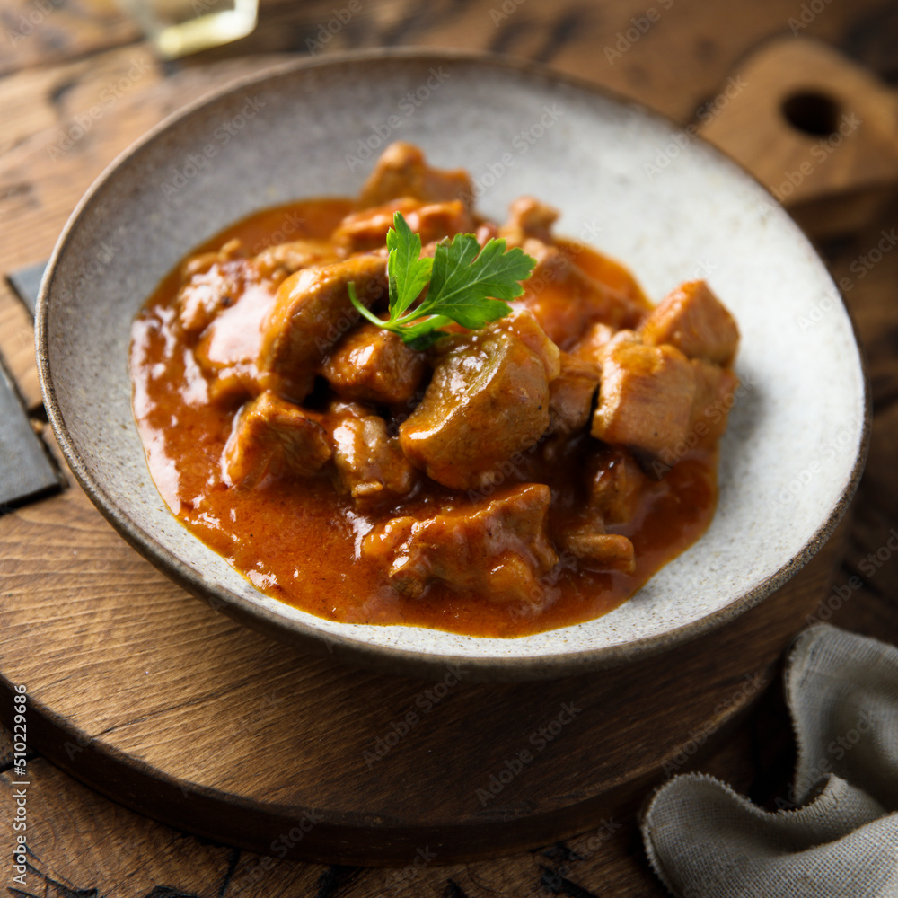 Homemade pork ragout with tomato sauce Homemade pork ragout with tomato sauce