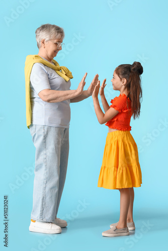 Little girl giving high-fiv...