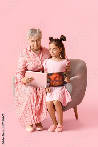 Senior woman with her littl...
