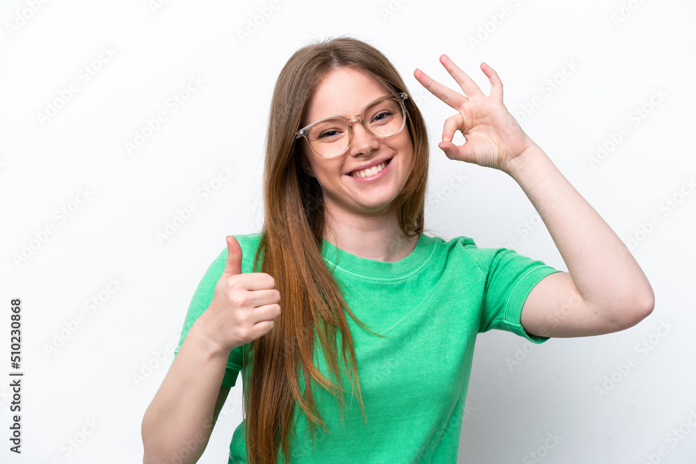 Young caucasian woman isolated on white background With glasses and doing OK sign Young caucasian woman isolated on white background With glasses and doing OK sign