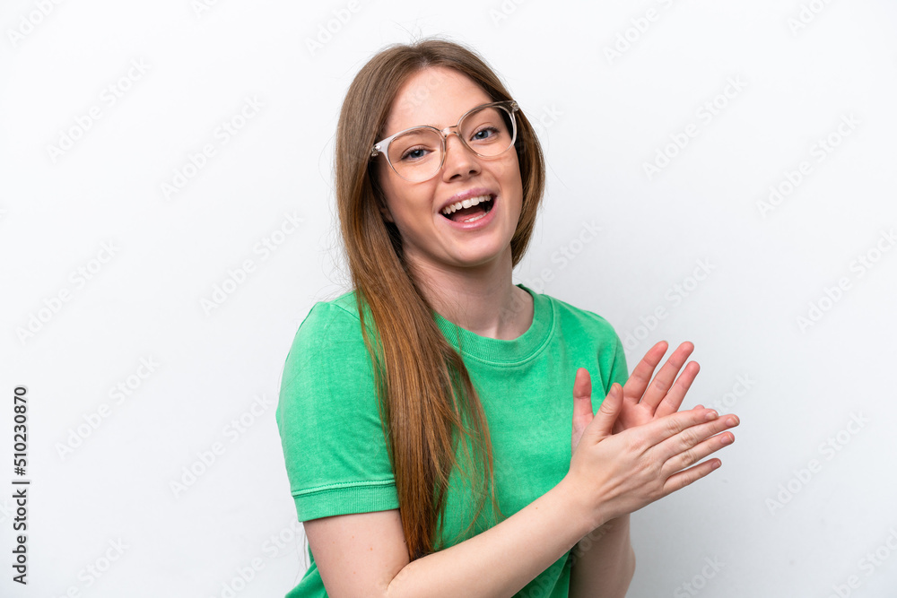 Fototapeta premium Young caucasian woman isolated on white background With glasses and applauding