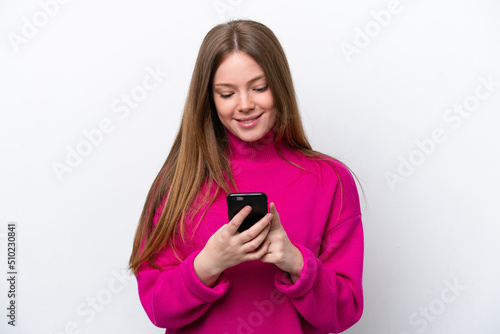 Young caucasian woman isolated on white background sending a message with the mobile