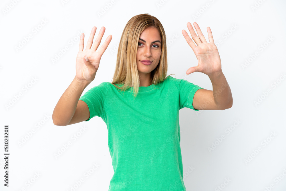 Fototapeta premium Blonde Uruguayan girl isolated on white background counting nine with fingers