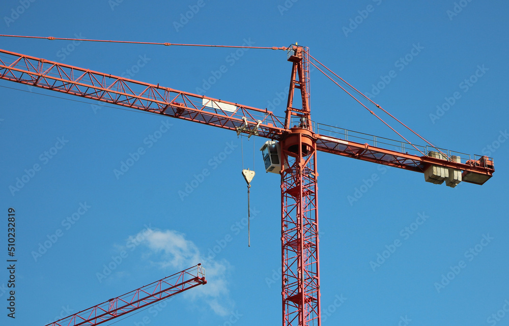 Detail of construction crane with blue sky Detail of construction crane with blue sky