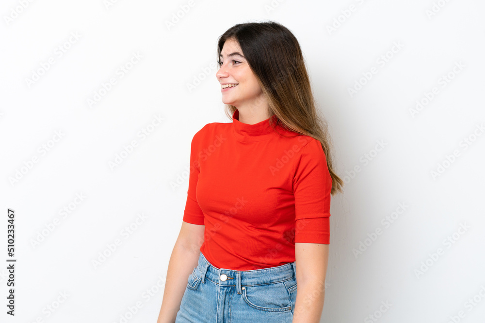 Fototapeta premium Young caucasian woman isolated on white background looking side