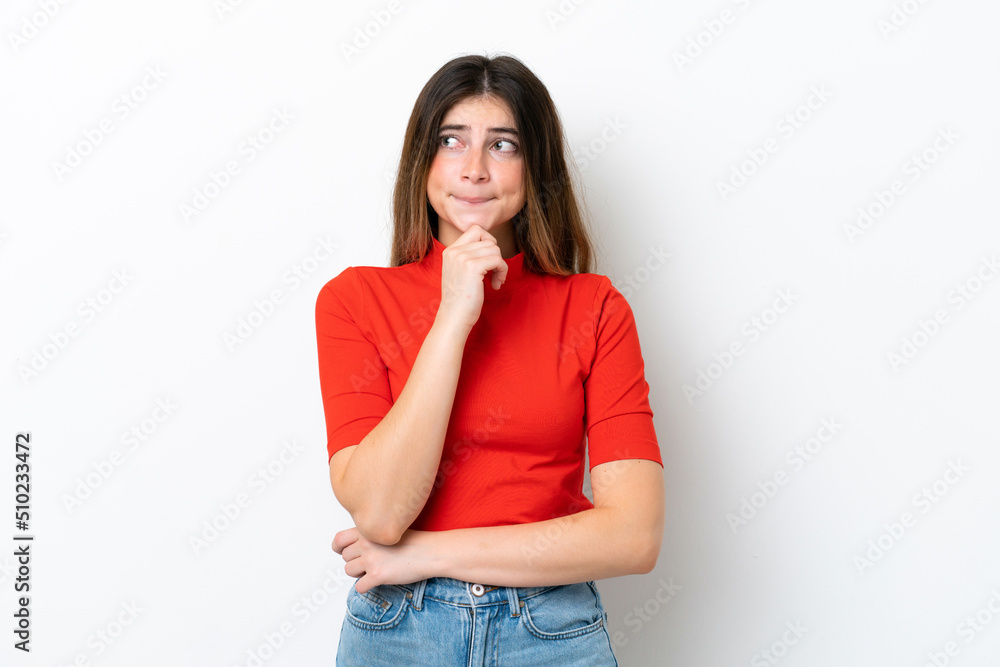 Young caucasian woman isolated on white background having doubts and thinking Young caucasian woman isolated on white background having doubts and thinking