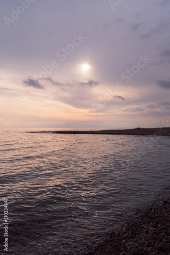 Beautiful Sunset At The Sea With Colorful Rays And Clouds