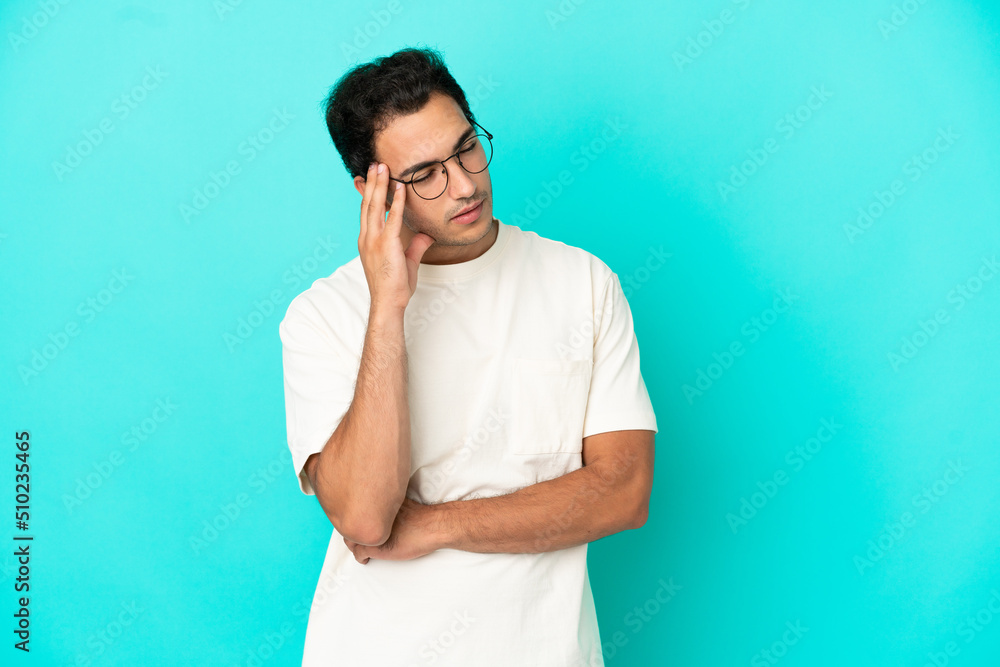Caucasian handsome man over isolated blue background with headache Caucasian handsome man over isolated blue background with headache