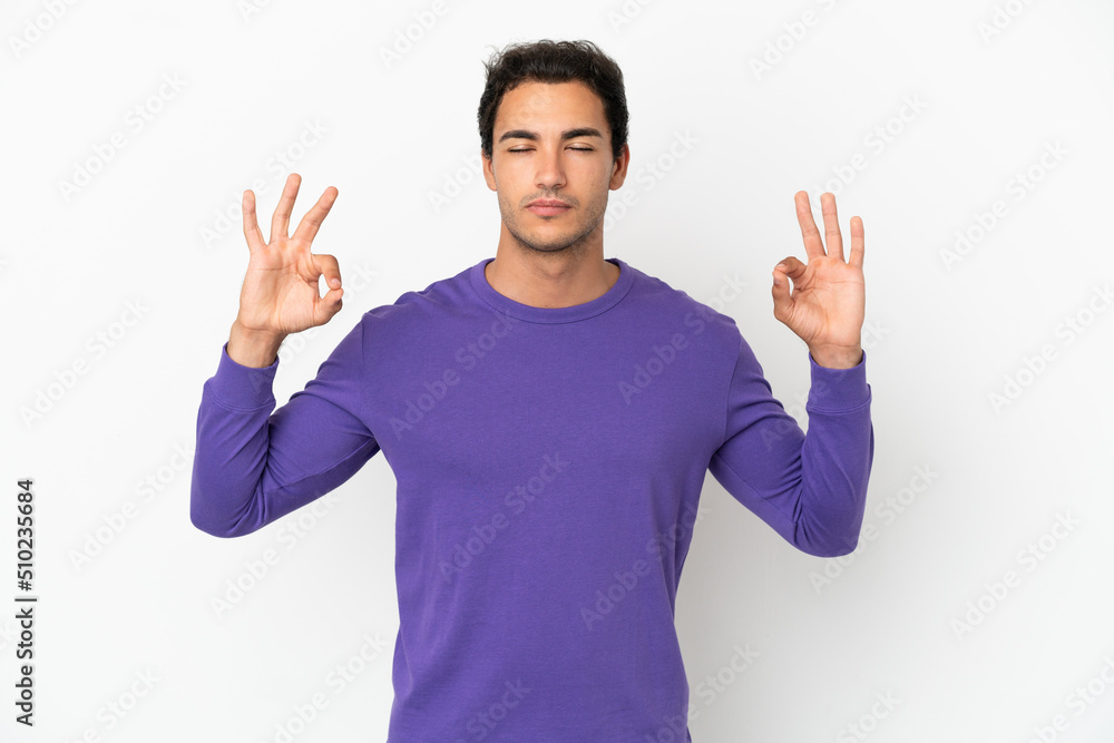 Caucasian handsome man over isolated white background in zen pose Caucasian handsome man over isolated white background in zen pose