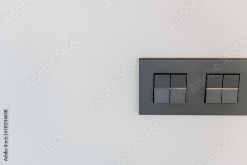 black light switches on a white wall of the house