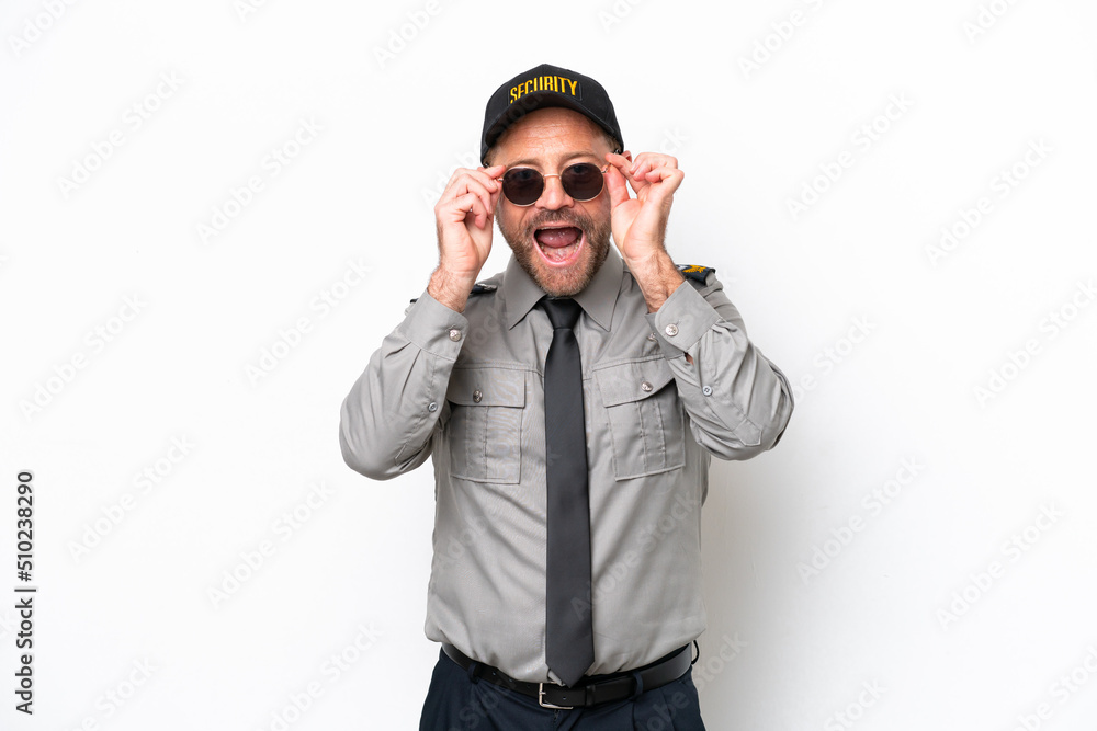 Middle age security man isolated on white background with glasses and surprised Middle age security man isolated on white background with glasses and surprised