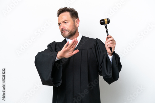 Middle age judge man isolated on white background making stop gesture and disappointed